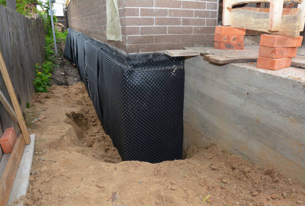 SJ Waterproofing Pros technician performing targeted Interior Drainage System assessment in Orange, VA